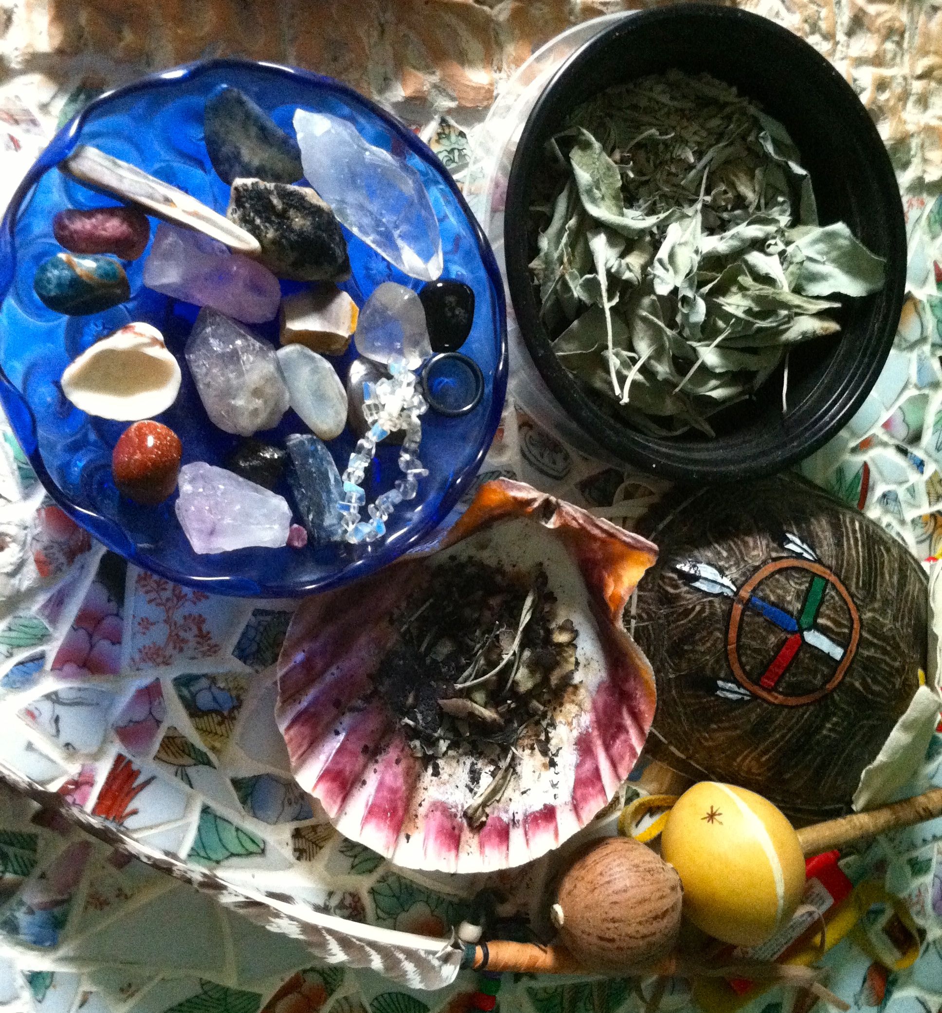 Some of my supplies: Stones and shells, Sage, Rattle, Feather.