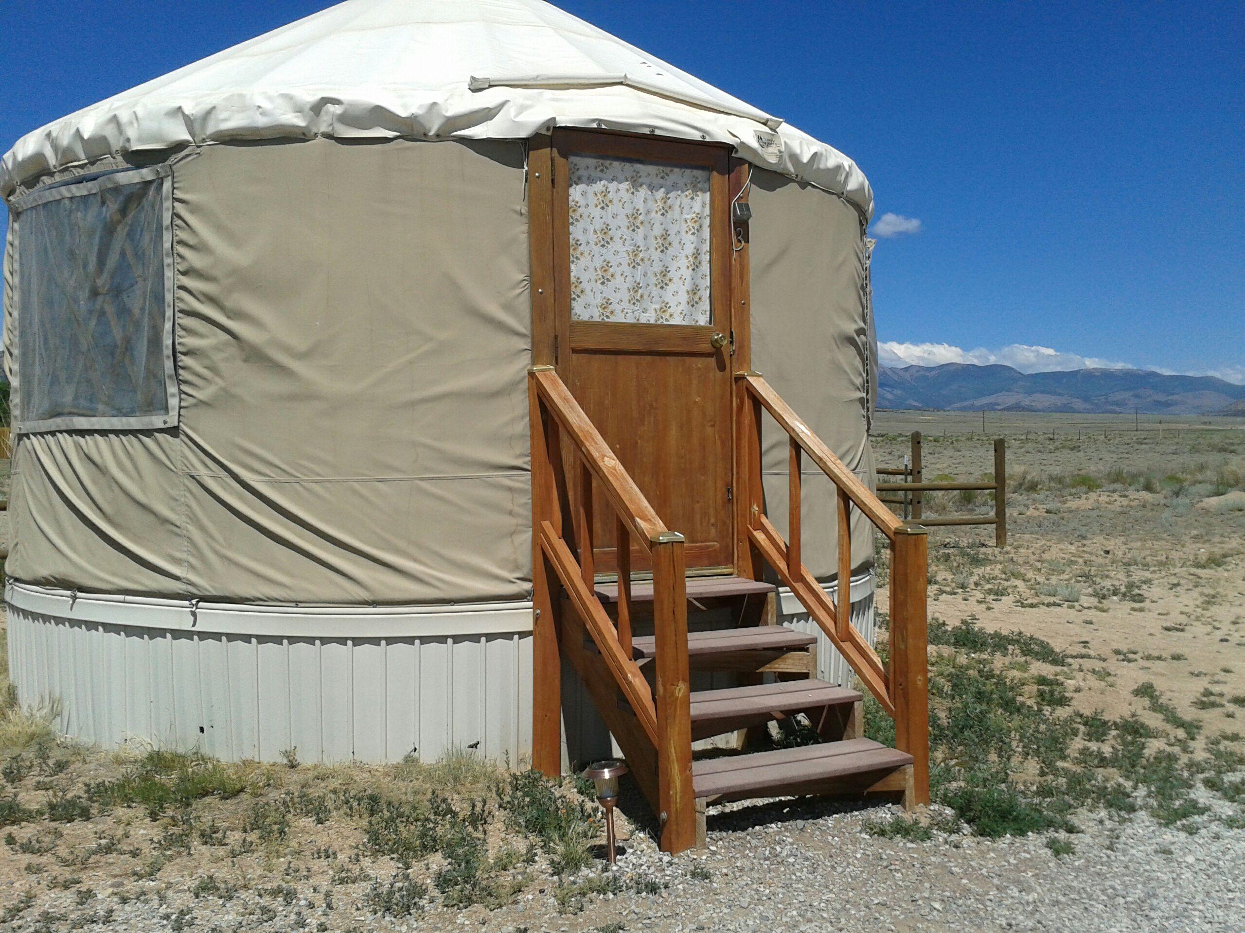 The yurt and the view outside: mountains, open spaces, pitch black at night with stars that freckled the sky. 